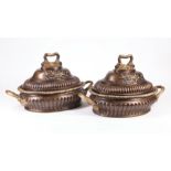 Pair of Pompeian-Style Bronze Covered Tureens, foliate and mask decoration, h. 14 in., w. 23 in., d.