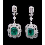 Pair of 18 kt. White Gold, Emerald and Diamond Dangle Earrings, central prong set rectangular step