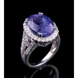 Platinum, Tanzanite and Diamond Ring, central prong set oval modified brilliant cut tanzanite, 13.17