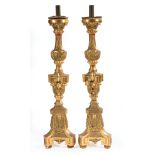 Pair of Large Continental Giltwood Candlesticks, 19th c., foliate designs, tripartite base, h. 47