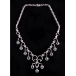 14 kt. White Gold, Tahitian Pearl and Diamond Necklace, 11 round black pearls, 10-11 mm; fringe with