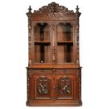 American Carved Oak Two-Part Cabinet, mid-19th c., attr. to Alexander Roux, New York elaborately