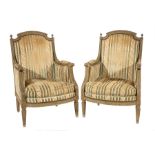 Pair of Louis XVI-Style Carved and Painted Bergeres, early 19th c., shaped gadrooned finialed