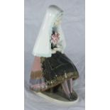 A boxed Lladro porcelain figure 'Girl Sitting With Roses' number 5127, 25cm high