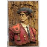 A Spanish Revival vanathane relief-mouled half-length portrait panel of Spanish Matador El Toro,