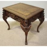 A Chinese carved hardwood side table or alter table, of rectangular form with inset panelled top