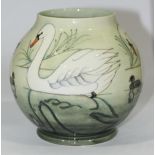 A Moorcroft pottery vase in the 'Swans' pattern, designed by Sally Tuffin, of globular form, limited