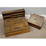 A table top writing desk with pigeonholes above a sloped scribe, opening to reveal storage space,