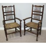 A set of seven 19th century oak chairs comprising two carvers and five standard chairs, all with