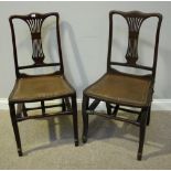 A pair of stained mahogany folding coaching chairs, with leather upholstered seats and studded