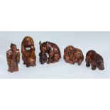 Five Japanese carved boxwood netsuke, comprising pig & rat, rhino, Samurai, monkey & rabbit, wolf