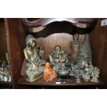 SECTION 49. A large selection of brass figurines including Happy Buddha, Ginesh, brass censor with