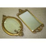 A Victorian moulded, gilt framed oval mirror with two sconces, together with a rectangular gilt