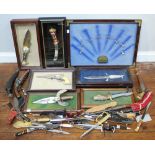 A large collection of assorted knives and decorative firearms, including 'General Custer's Revolver'