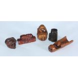 Five Japanese carved boxwood netsuke comprising a bat & bamboo, snake & skull, monkey & jar, bug &