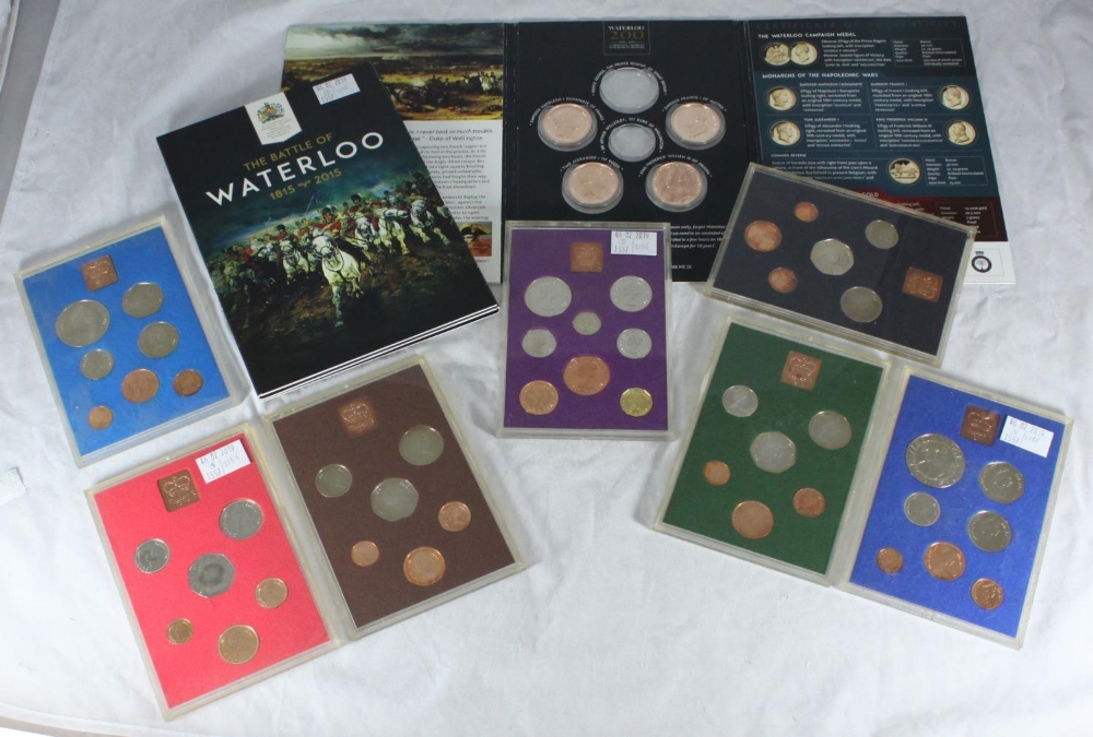 Two Waterloo Mint cased part coin sets comprising five bronze coins in total, together with seven