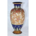 A Royal Doulton Slaters stoneware baluster vase decorated in shades of orange and white on a leather