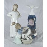 Three assorted boxed Lladro porcelain figures comprising 'Time to Sew' number 5501, 'Bashful Bather'