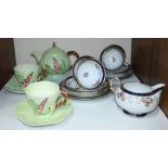 SECTION 21. A Carltonware teapot with two-each cups and saucers and a Noritake part tea set