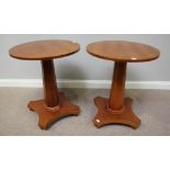 A pair of William Maclean laminate circular occasional tables, raised on tapering octagonal