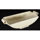 A Trentham Art Ware pottery bowl of Art Deco elliptical shape with hollow tubular handles and