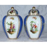 A pair of German porcelain blue-ground ovoid vases, with dome covers, the sides decorated with