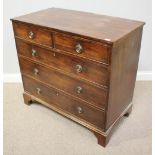 A 19th century mahogany chest of two short over three long graduated drawers with turned brass