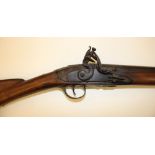 An 18th Century flintlock musket, with 36-inch barrel, .733inch muzzle bore, walnut stock with brass