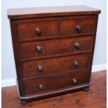 A Victorian mahogany chest of two short over three long graduated drawers, with flame mahogany