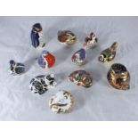 SECTION 36. Eleven assorted Royal Crown Derby ceramic paperweights modelled as birds and a cat etc.
