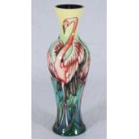A Moorcroft pottery vase in the 'Everglade Flamingo' pattern designed by Philip Gibson, signed