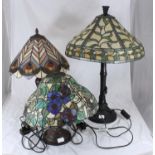 Three various Tiffany style lamps, one with blue pansies and butterflies (as found), one with