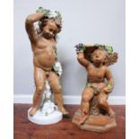Two matched early 20th century painted terracotta garden ornaments one modelled as a cherub, the