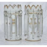 A pair of Victorian opaque white glass hanging lustre vases with gilded decoration, 28cm high