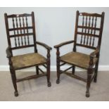 A set of seven 19th century oak chairs comprising two carvers and five standard chairs, all with