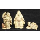 Three various carved ivory Netsuke figures, a warrior, a man carrying a wide brimmed hat and a boy