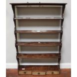 A George III mahogany set of open hanging shelves, with fret-cut shaped sides and five shelves above