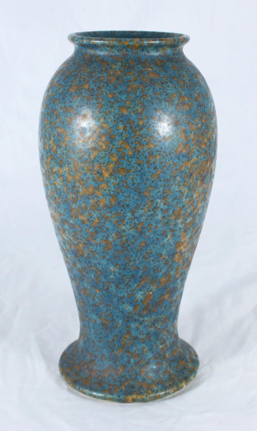 A Ruskin mottled pottery vase, of inverted baluster form with spreading foot, decorated in blue