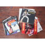 A small collection of assorted Elvis Presley items comprising 'Elvis The Other Sides' and 'Worldwide