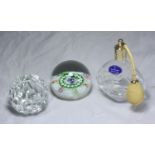 A clear cut-glass Whitefriars paperweight together with a millefiori Caithness paperweight and a