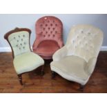 Two assorted nursing chairs, each with button-back fabric upholstery and raised on turned front