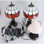 Three modern lead-glazed coloured glass lamps and a 1930s black and pink glass table lamp with