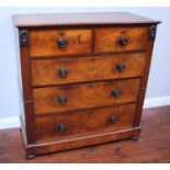 A Victorian flame mahogany veneered chest of two short, over three long graduated drawers with