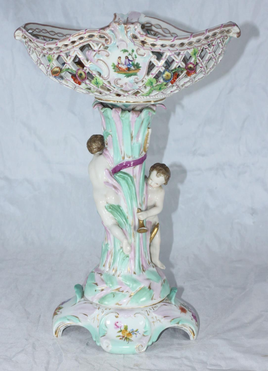 A German porcelain centrepiece with pierced and floral encrusted bowl supported by two putti, on - Bild 2 aus 2