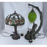 A Tiffany style multi-coloured lamp together with a lamp in the shape of a fruiting vine with a