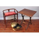 A stained mahogany piano stool with red upholstered seat, together with a small folding table with