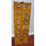 A large vintage yellow metal industrial filing cabinet, 14 drawers with brushed steel handles