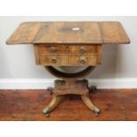 A Regency flame mahogany drop-leaf work table, with deep drawer and lift-out secret compartment,