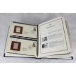 A collection of approximately 110 '22ct Golden Replicas of British Stamps' across four albums,