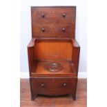 A George III stained mahogany night commode modelled as a chest of drawers, with hinged top and
